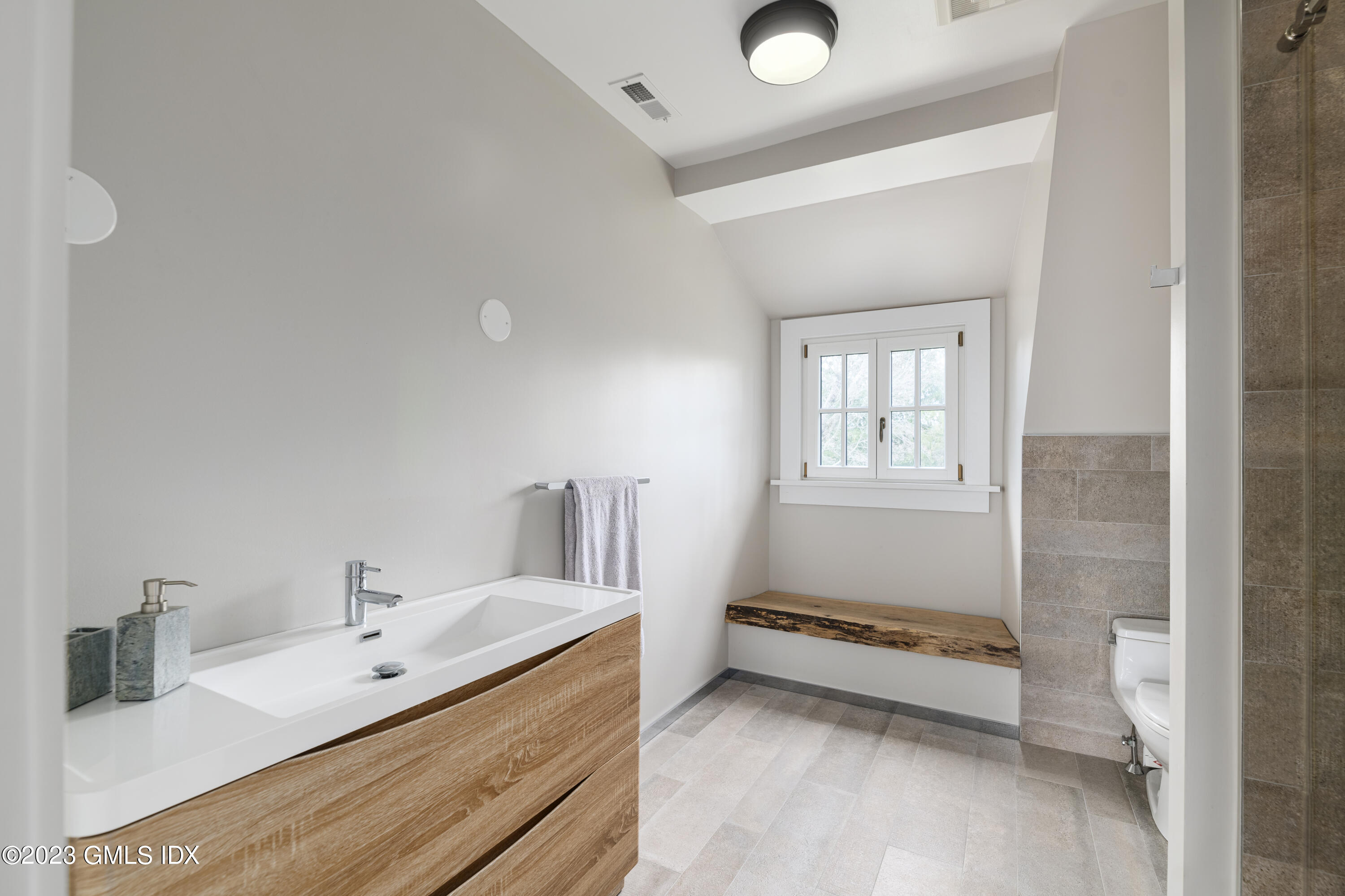 15 Upper Cross Road Greenwich, CT 06831 - Photo 33 of 39 a bathroom with a sink and a mirror