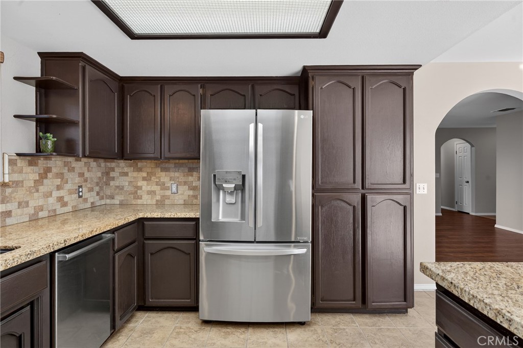 2097 Fallbrook Court Paso Robles, CA 93446 - Photo 12 of 65 a kitchen with stainless steel appliances granite countertop a refrigerator and a sink