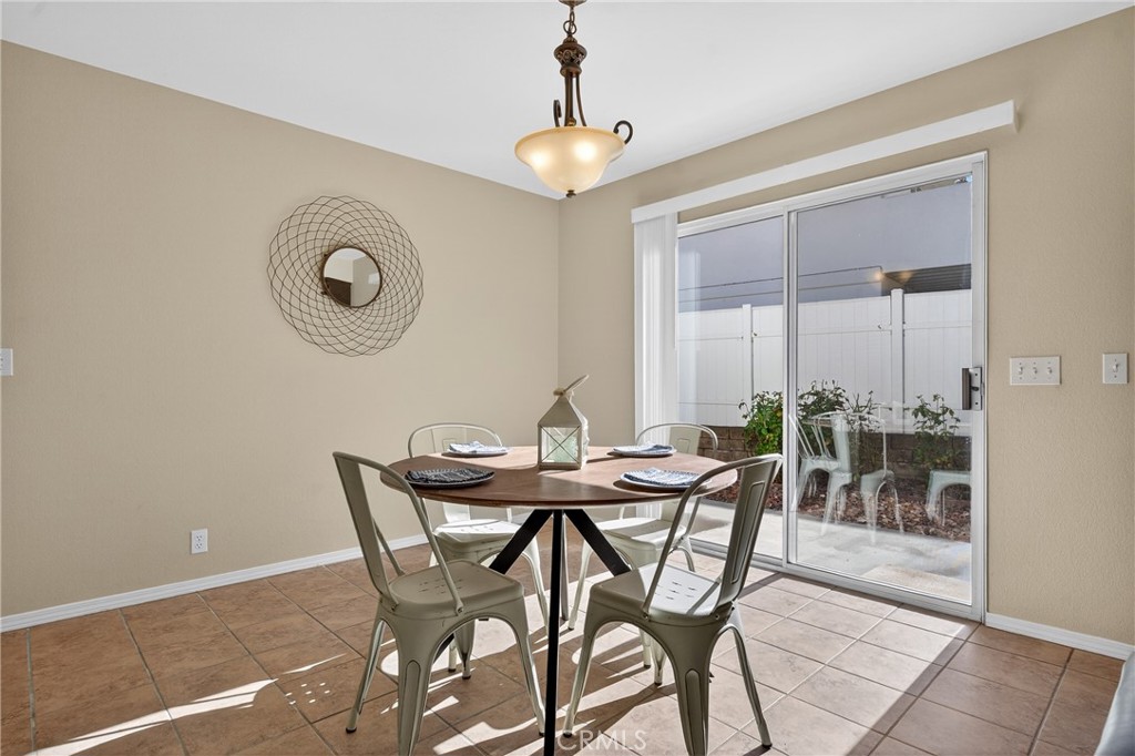 2097 Fallbrook Court Paso Robles, CA 93446 - Photo 16 of 65 a view of a dining room with furniture and chandelier