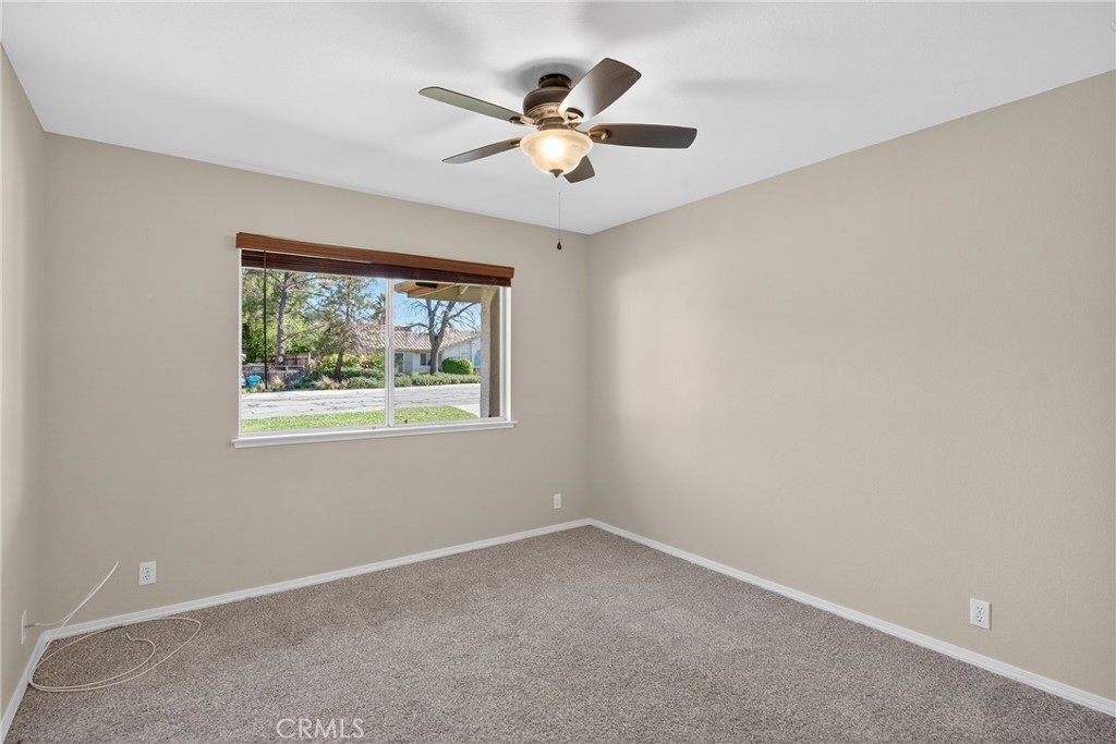 2097 Fallbrook Court Paso Robles, CA 93446 - Photo 29 of 65 an empty room with ceiling fan and window