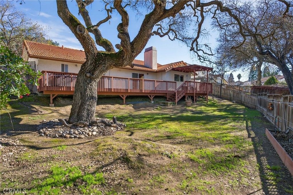 2097 Fallbrook Court Paso Robles, CA 93446 - Photo 46 of 65 a view of a house with a yard fire pit and a large tree