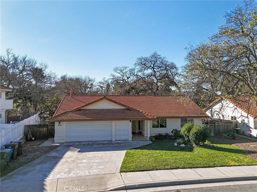 2097 Fallbrook Court Paso Robles, CA 93446 - Photo 52 of 65 a front view of a house with a yard