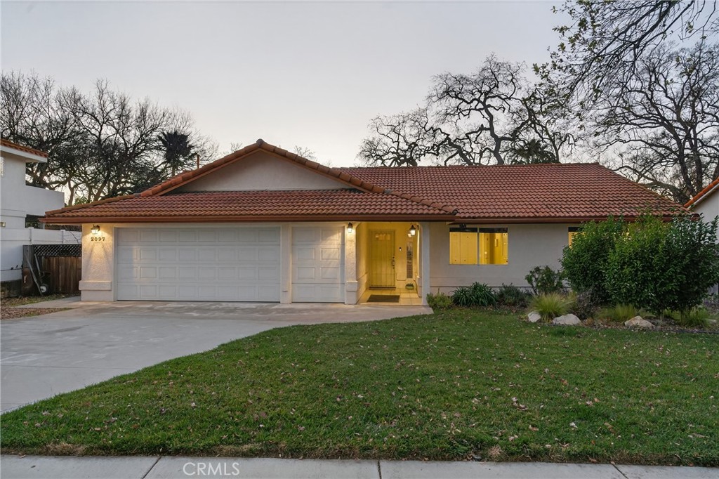 2097 Fallbrook Court Paso Robles, CA 93446 - Photo 59 of 65 a front view of a house with a yard and garage