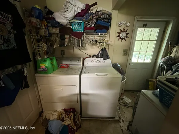 a room with water heater and refrigerator