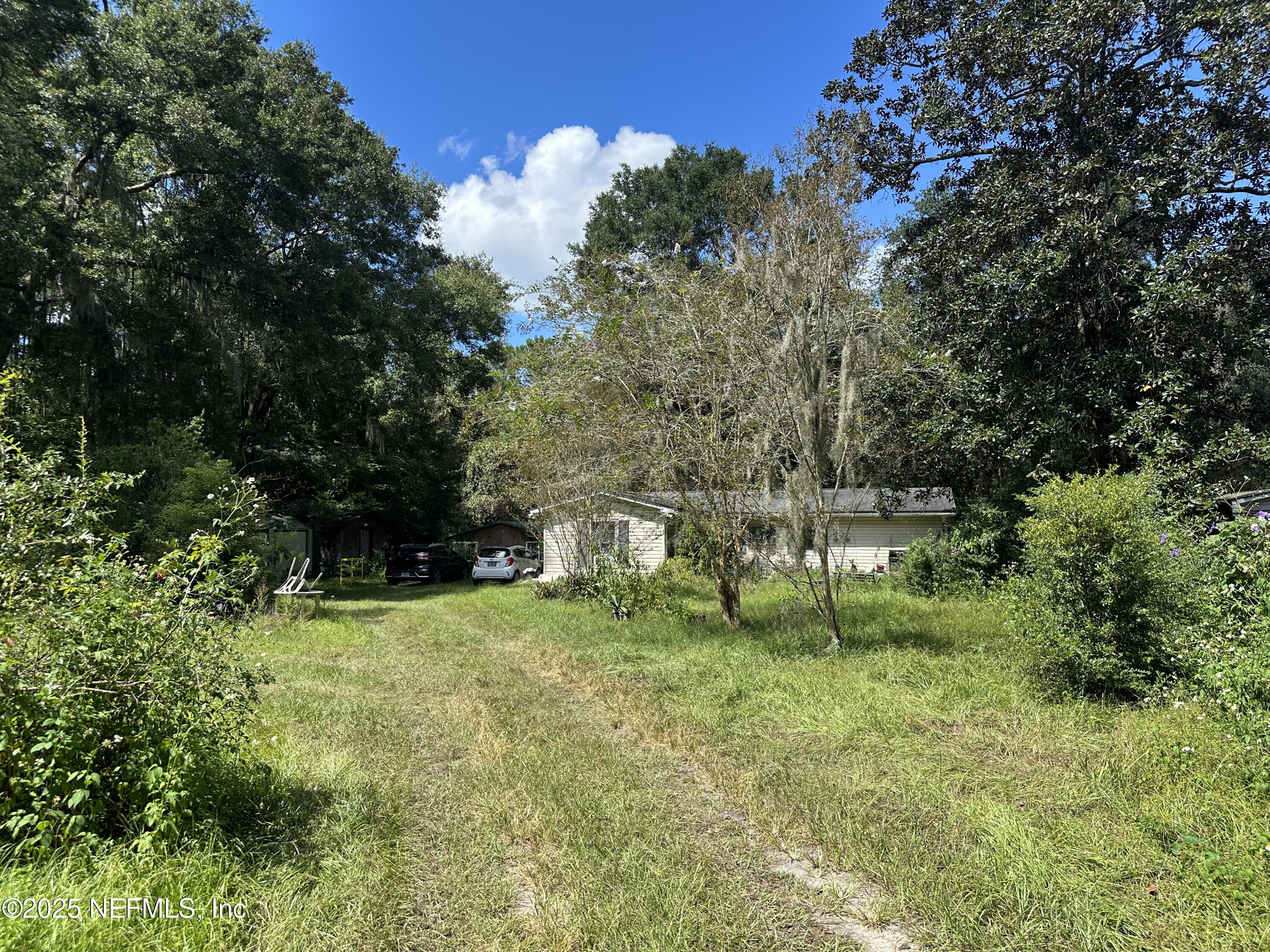 86011 John Street Yulee, FL 32097 - Photo 15 of 18 a green field with lots of bushes