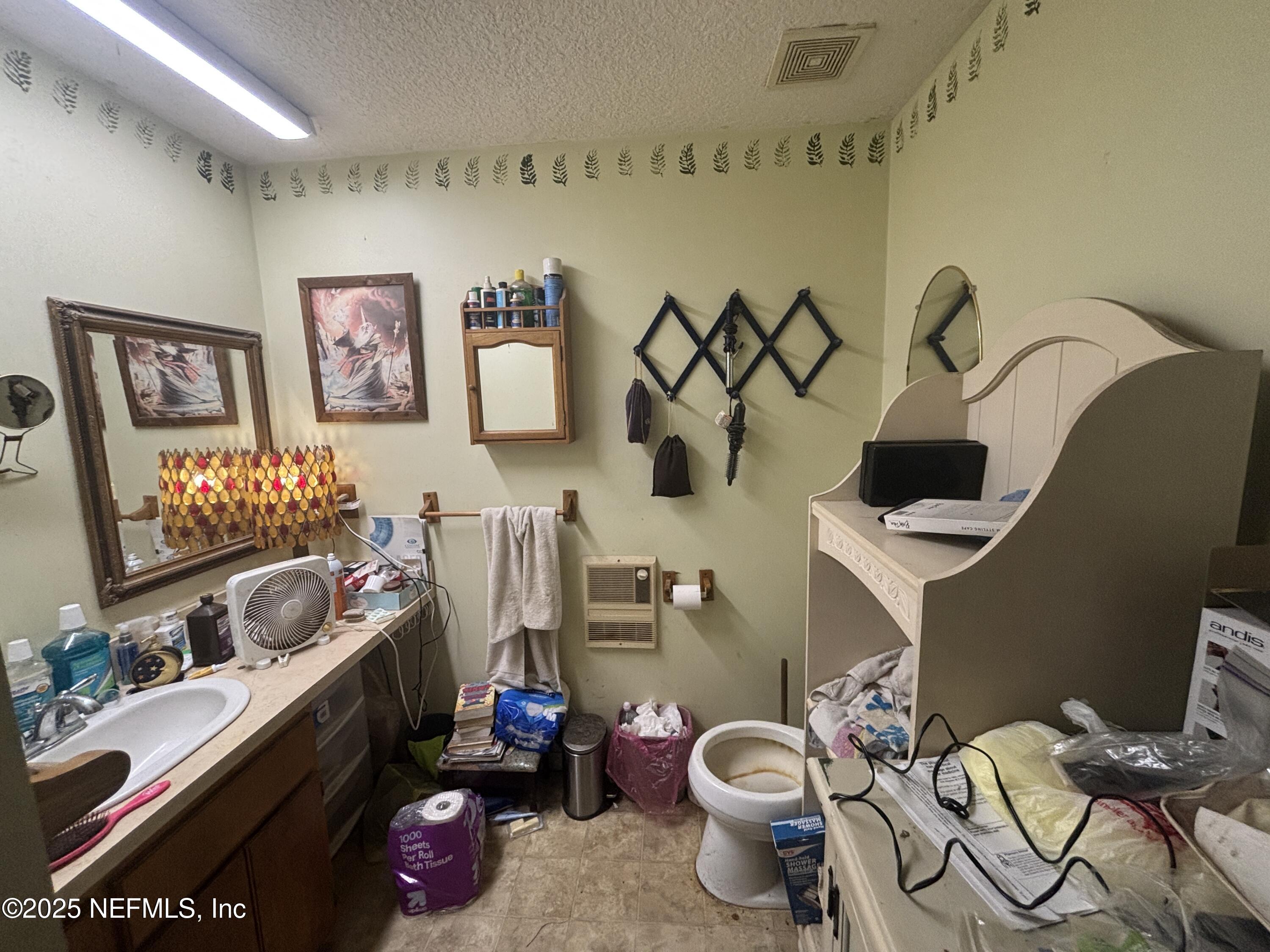 86011 John Street Yulee, FL 32097 - Photo 8 of 18 a room with a baby crib toys and couches next to a window