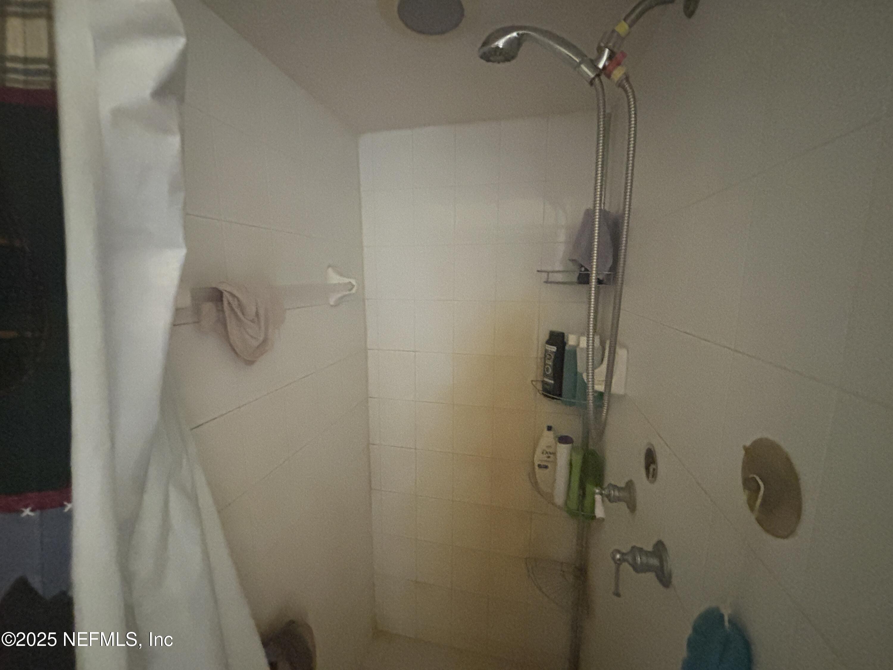 86011 John Street Yulee, FL 32097 - Photo 10 of 18 a bathroom with a shower