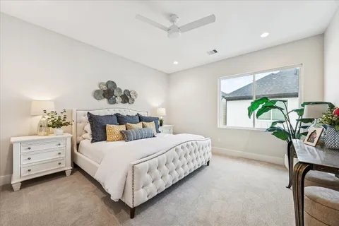 a bedroom with a bed and a table