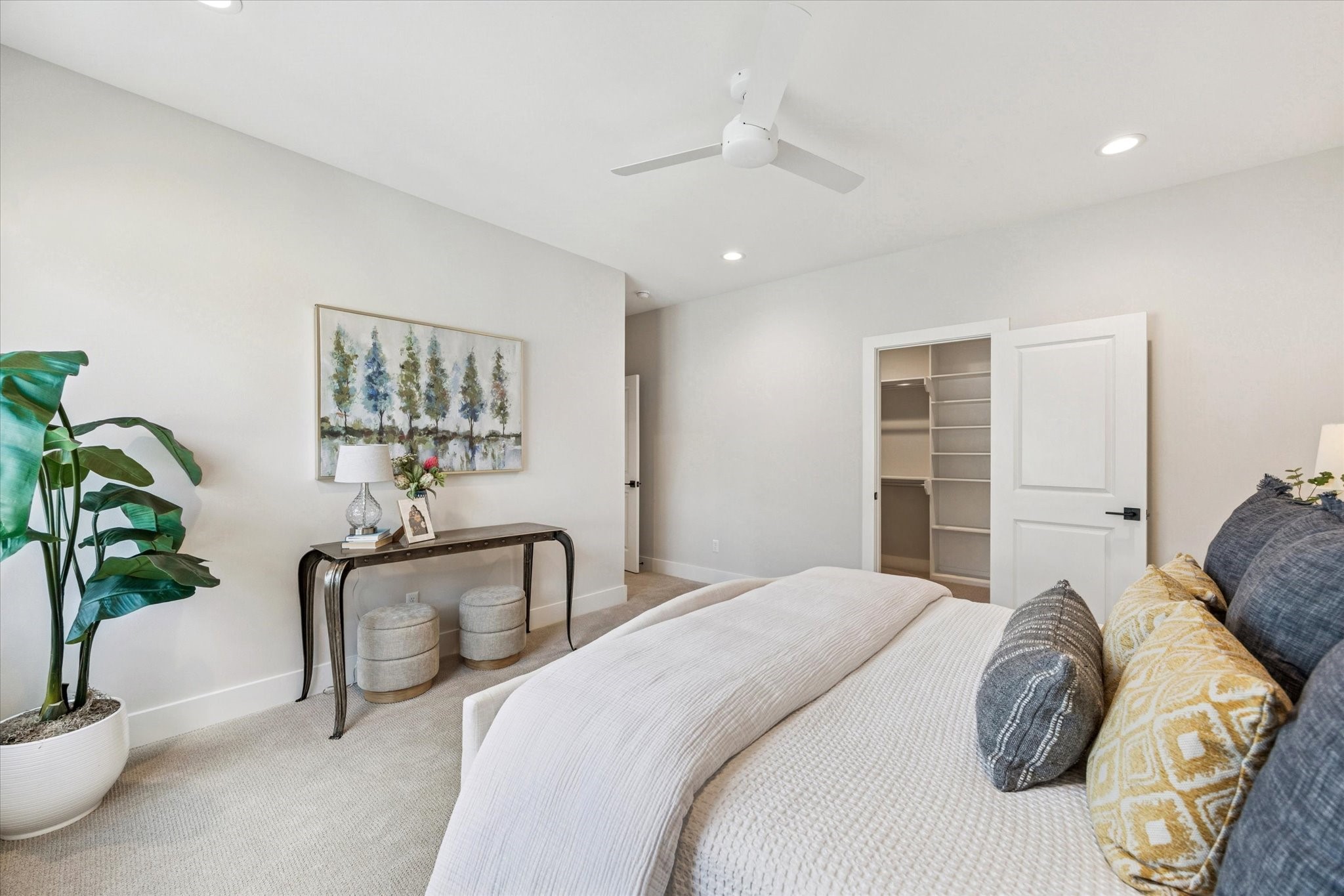 526 Janisch Road Houston, TX 77018 - Photo 17 of 34 a bedroom with a bed and a potted plant