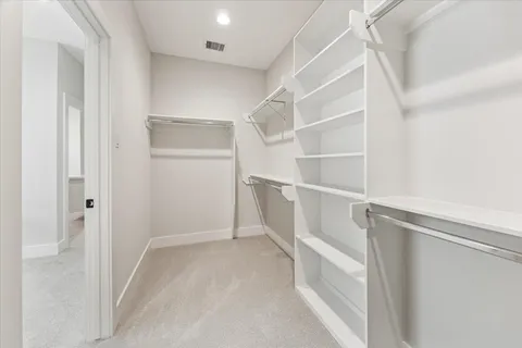 a view of an empty walk in closet
