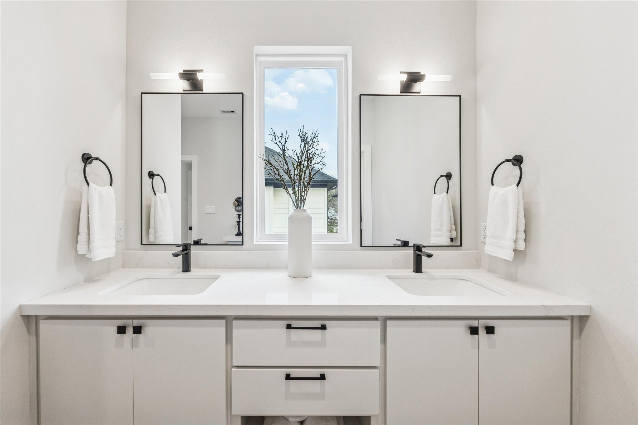526 Janisch Road Houston, TX 77018 - Photo 20 of 34 a bathroom with double vanity and a mirror