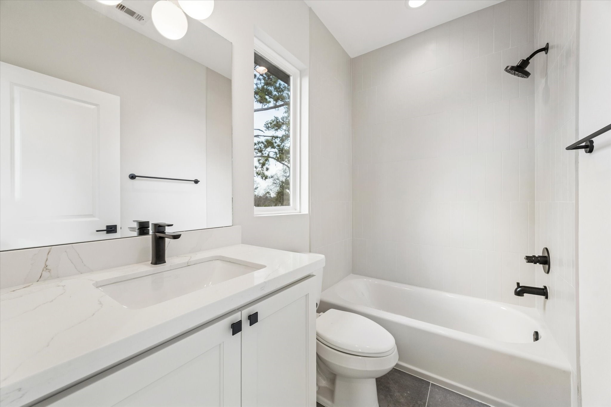 526 Janisch Road Houston, TX 77018 - Photo 23 of 34 a bathroom with a sink a toilet and bathtub