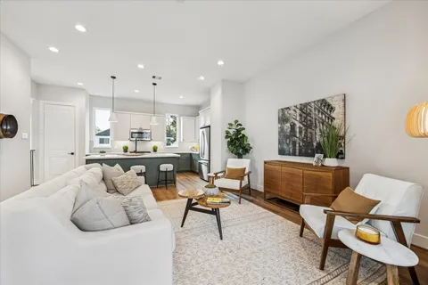 a living room with furniture and a table