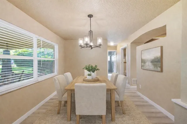 a large kitchen with stainless steel appliances kitchen island granite countertop a large counter top and stove