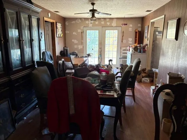 a view of a dining room with furniture and window