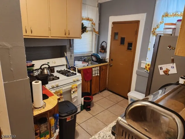 a dining room with furniture and a window