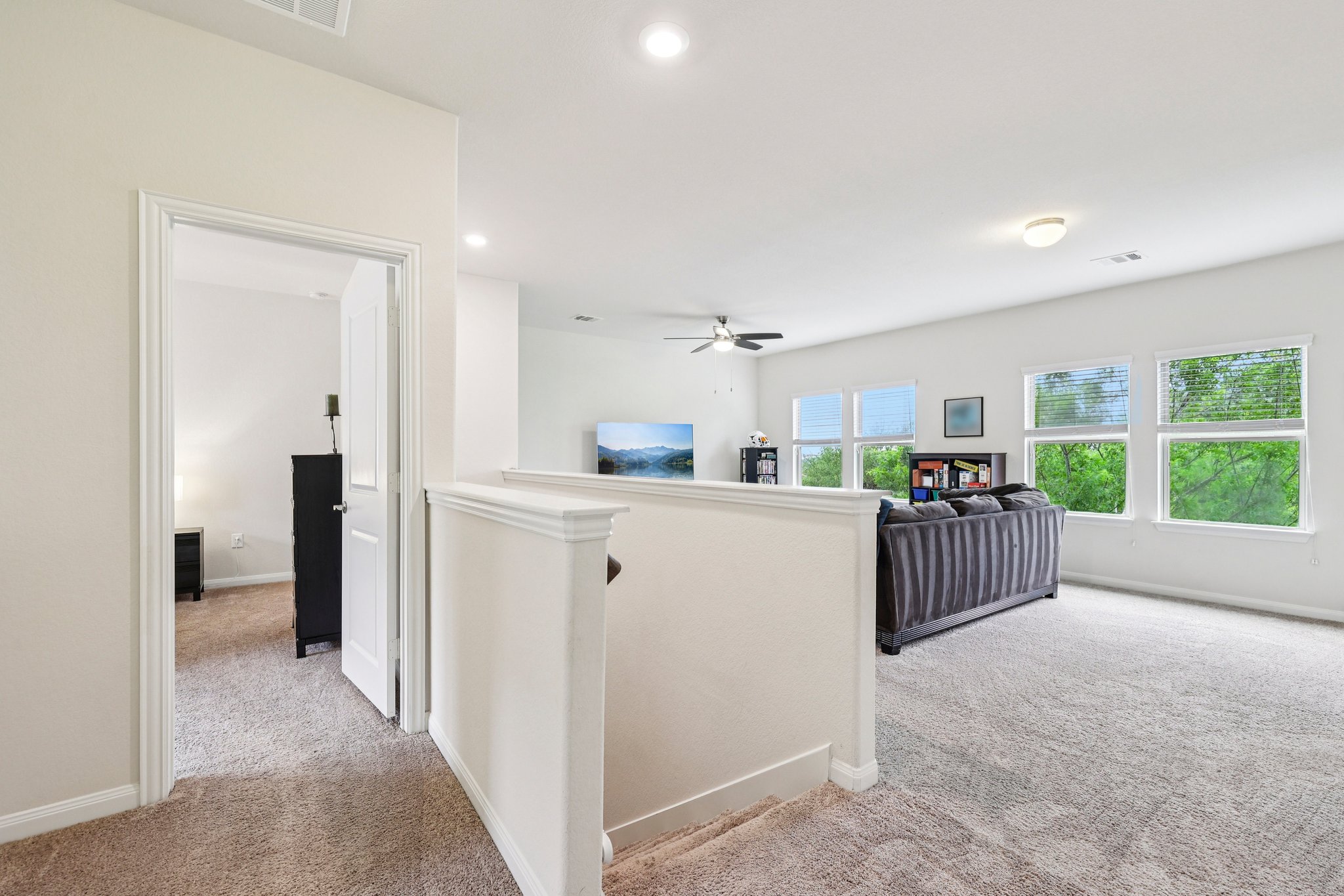 10033 Gertrudis Loop Austin, TX 78747 - Photo 14 of 39 This versatile space features carpeting, recessed lighting, and a ceiling fan, with natural light from multiple windows