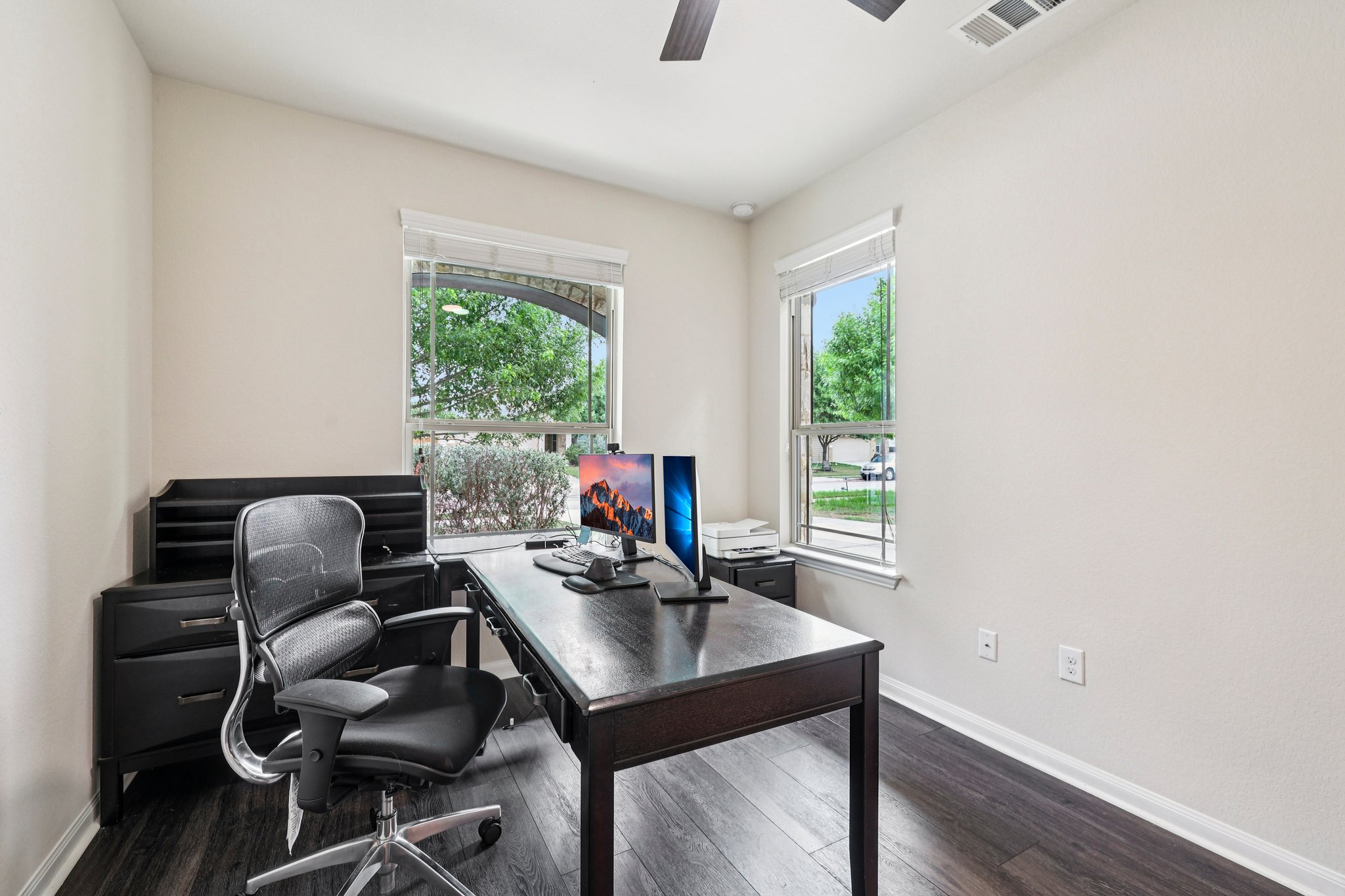 10033 Gertrudis Loop Austin, TX 78747 - Photo 8 of 39 This room features light-colored walls and dark flooring, providing a neutral aesthetic