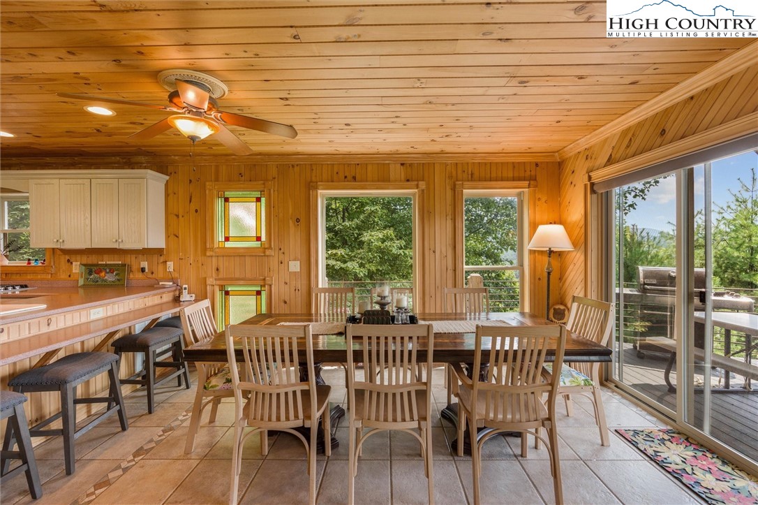 411 West Ridge Drive Ferguson, NC 28624 - Photo 24 of 45 a view of a dining room with furniture window and outside view