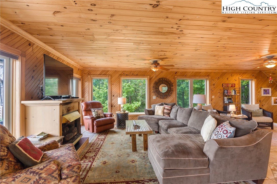 411 West Ridge Drive Ferguson, NC 28624 - Photo 27 of 45 a living room with furniture and a large window