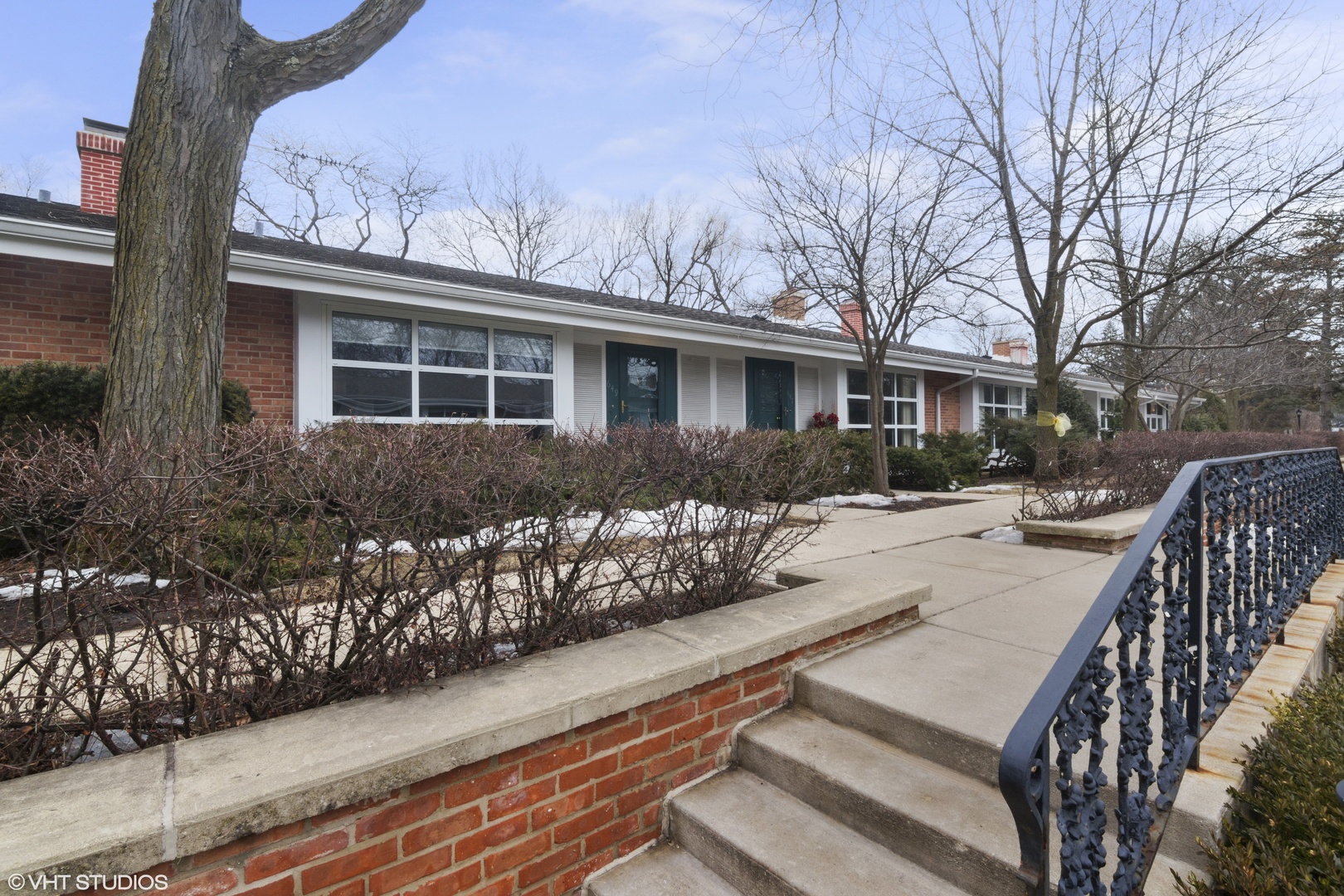 649 Spring Road Glenview, IL 60025 - Photo 2 of 16 a view of a house with wooden deck and furniture