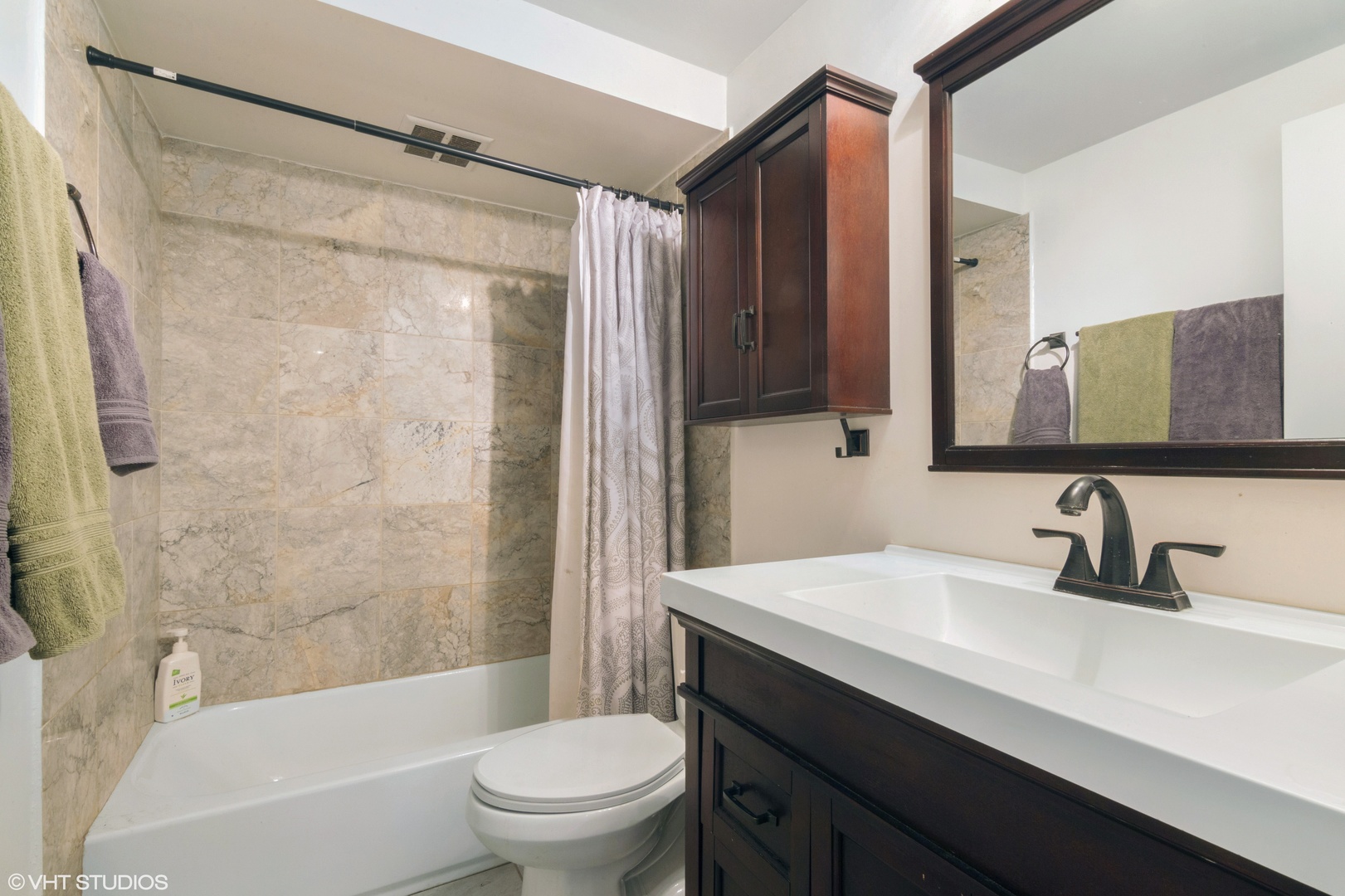 649 Spring Road Glenview, IL 60025 - Photo 11 of 16 a bathroom with a sink a toilet a mirror a vanity and shower