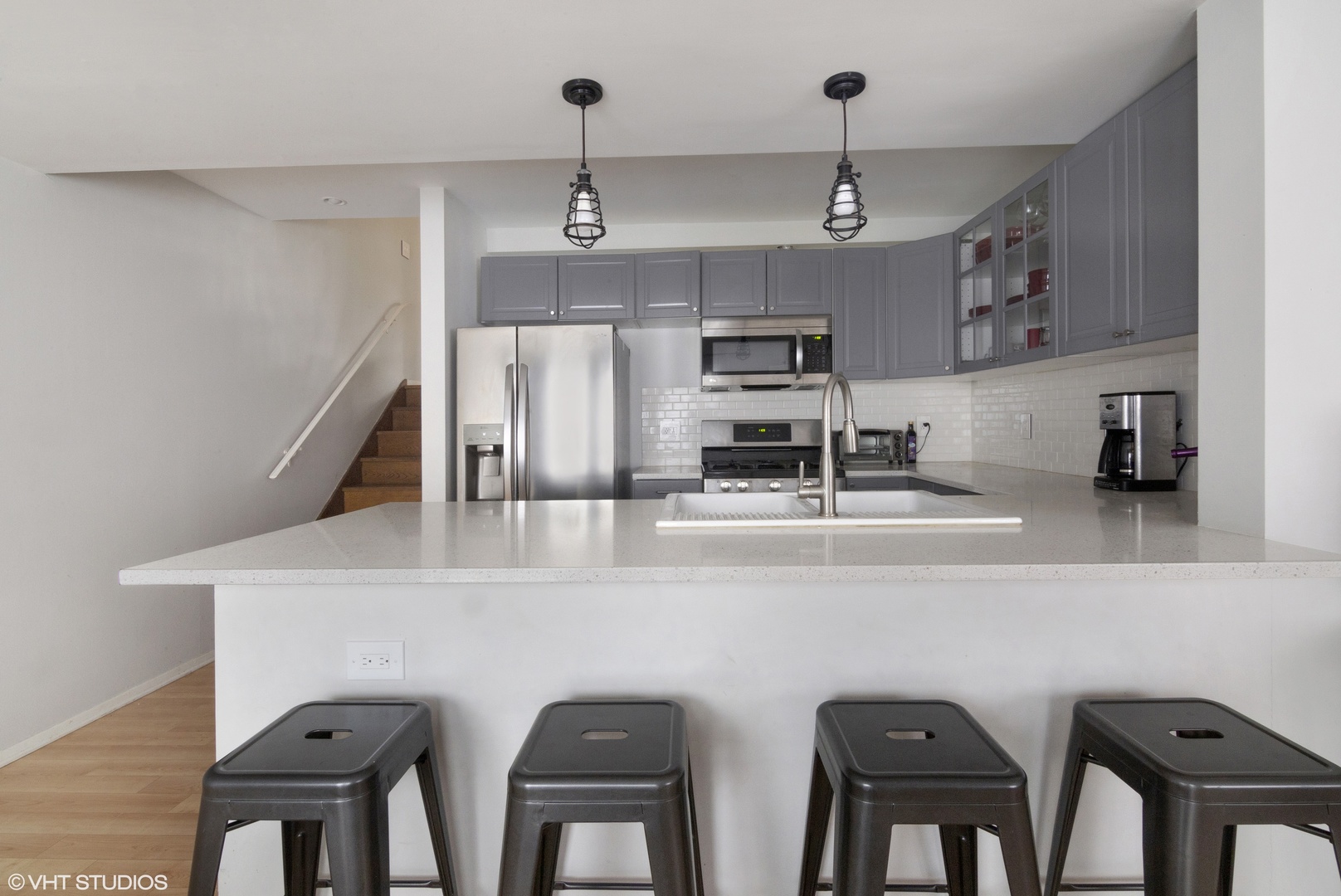 649 Spring Road Glenview, IL 60025 - Photo 7 of 16 a kitchen with stainless steel appliances a table and chairs in it