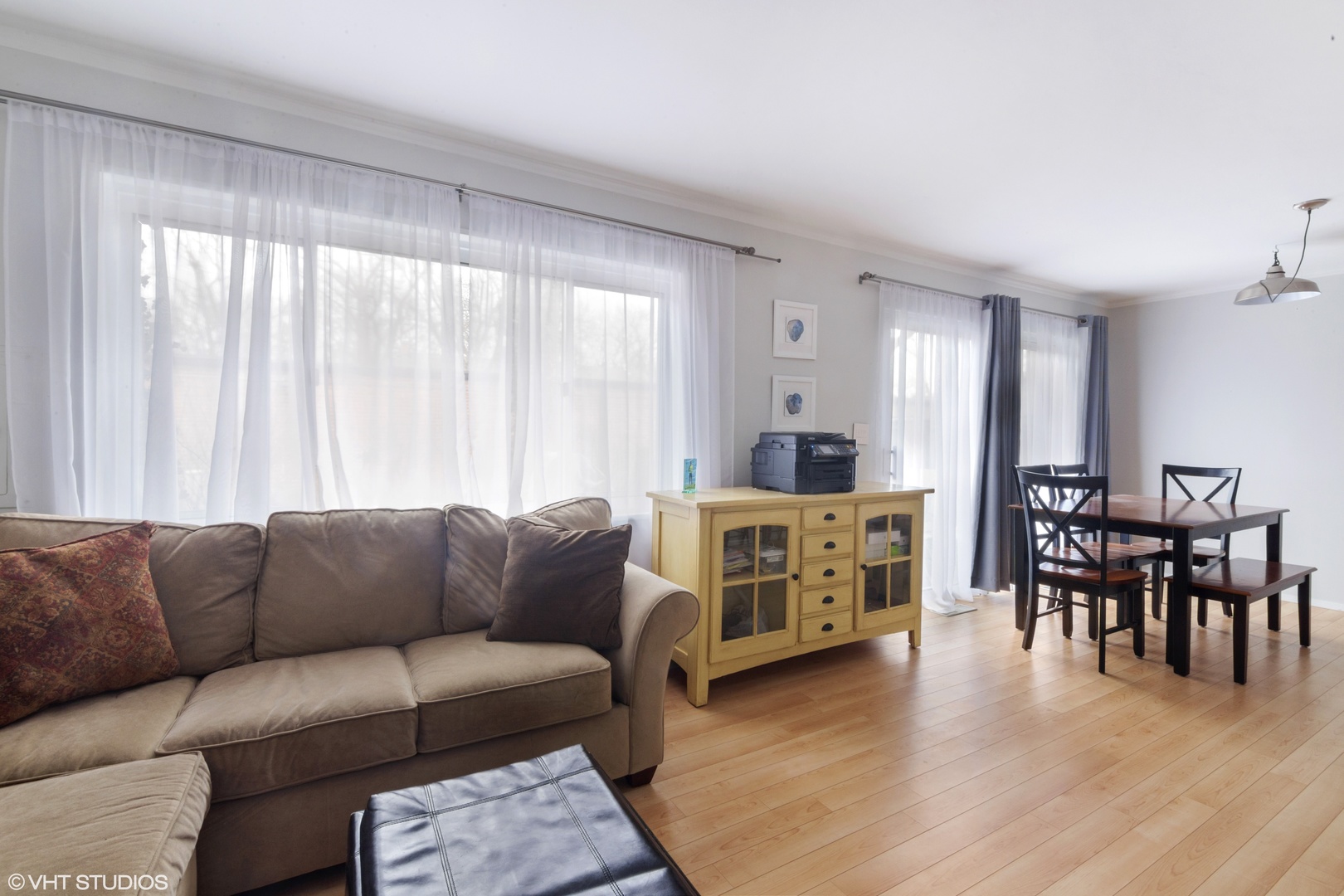 649 Spring Road Glenview, IL 60025 - Photo 8 of 16 a living room with furniture and a dining table with wooden floor