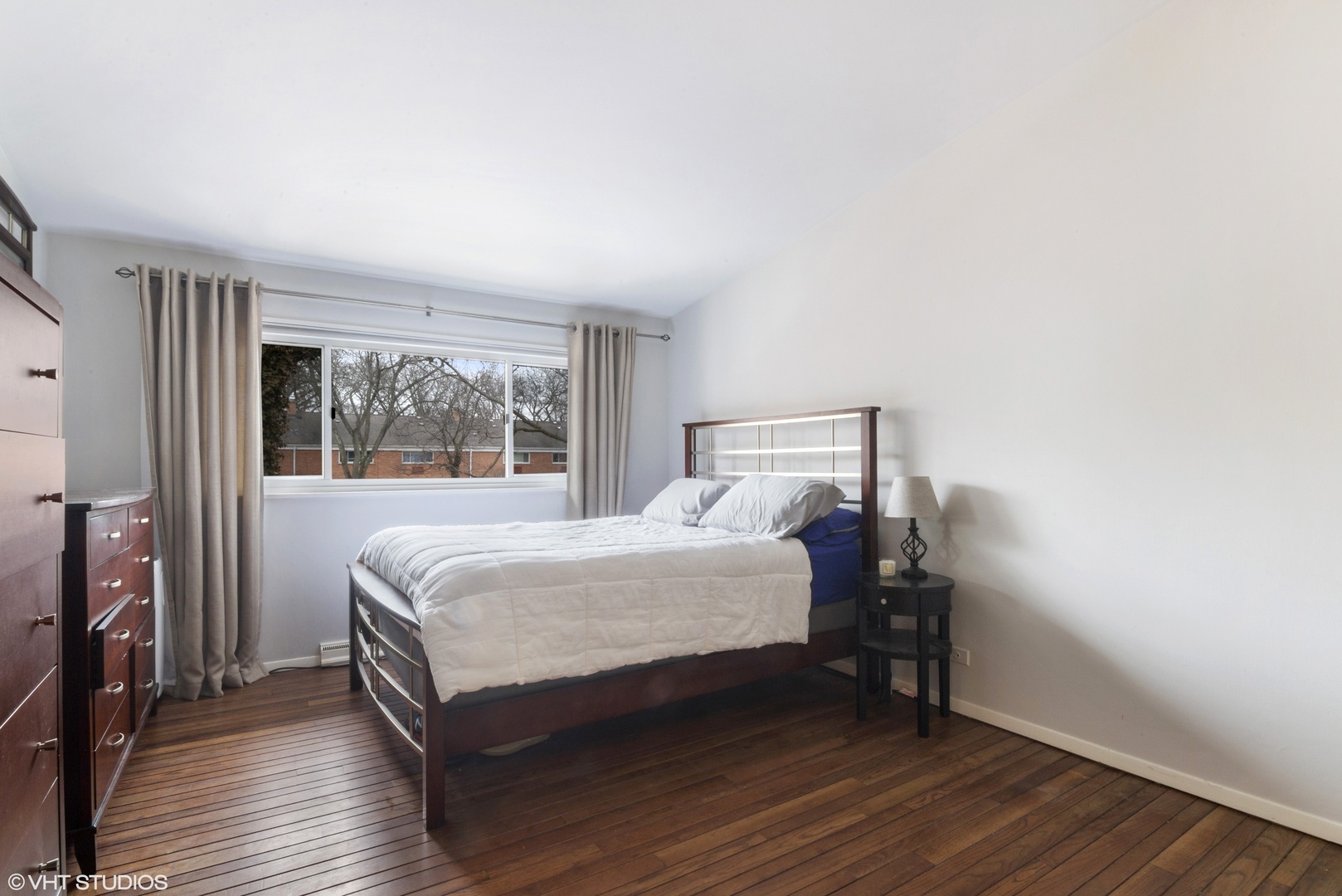 649 Spring Road Glenview, IL 60025 - Photo 9 of 16 a bedroom with a bed and wooden floor