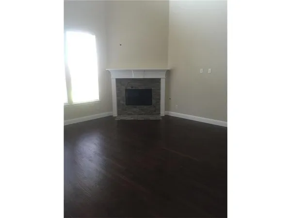 a view of a livingroom with wooden floor
