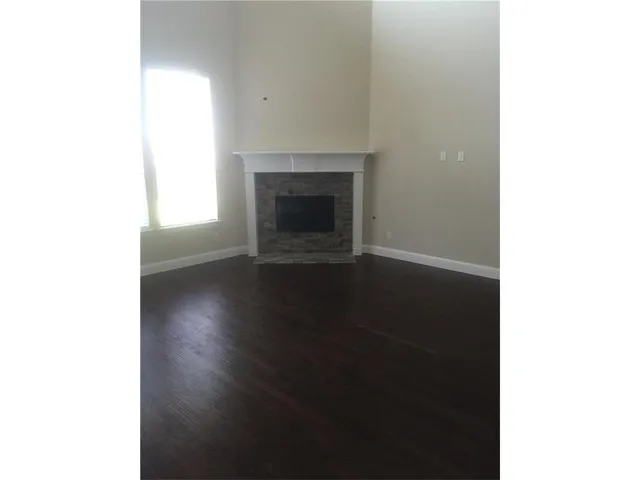 a view of a livingroom with wooden floor