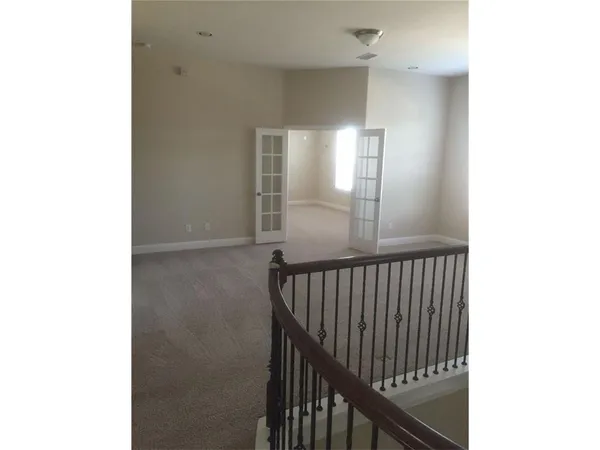 a view of a hallway with windows