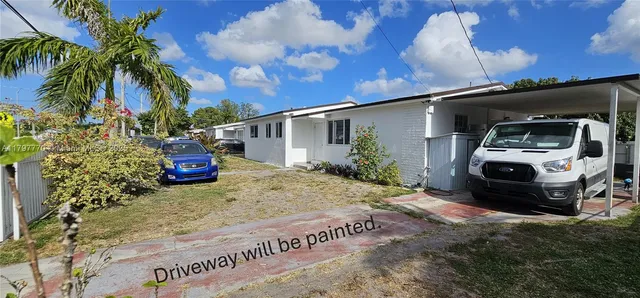 a view of a back yard of the house