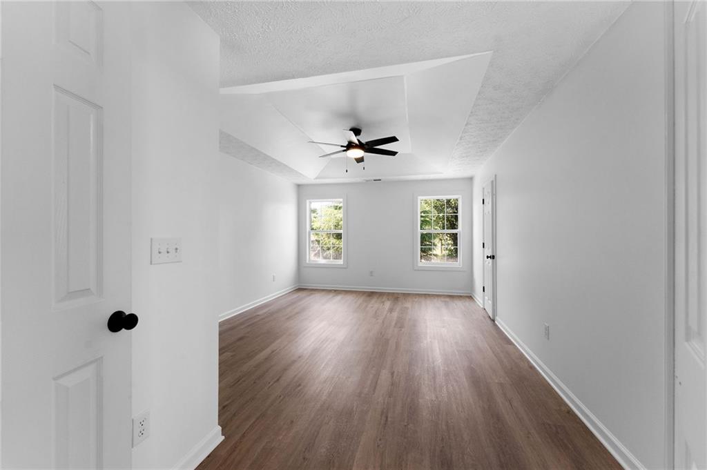 20 Mallet Pointe Street Northeast Cartersville, GA 30121 - Photo 20 of 37 wooden floor in an empty room with a window