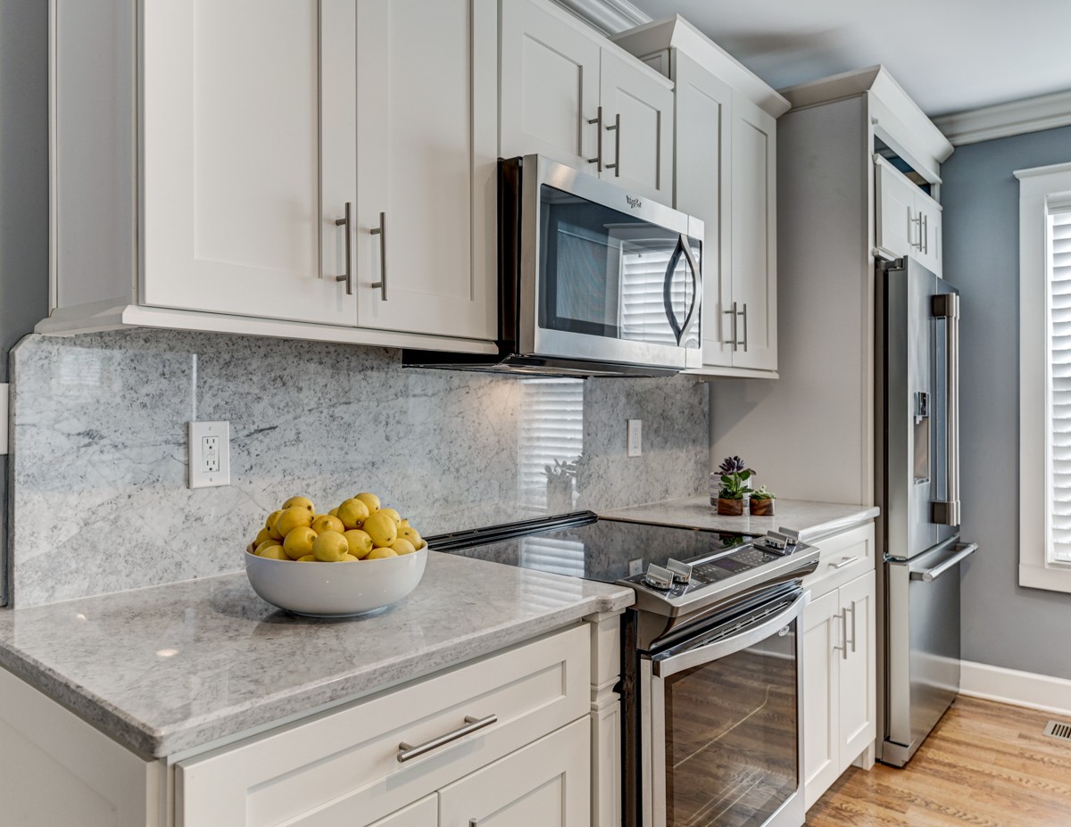 815 Lischey Avenue Nashville, TN 37207 - Photo 12 of 34 a kitchen with stainless steel appliances granite countertop white cabinets and a stove