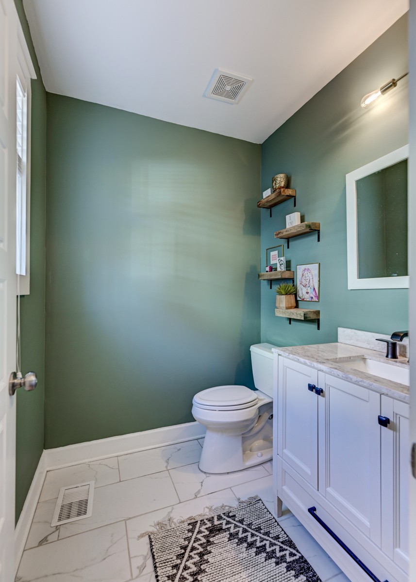 815 Lischey Avenue Nashville, TN 37207 - Photo 16 of 34 a bathroom with a toilet a sink and mirror