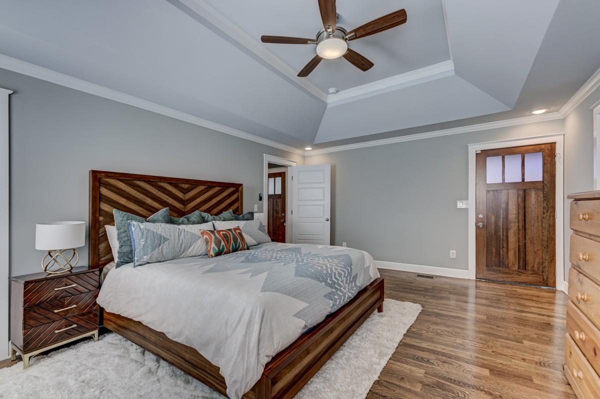 815 Lischey Avenue Nashville, TN 37207 - Photo 18 of 34 a bedroom with a bed and large mirror