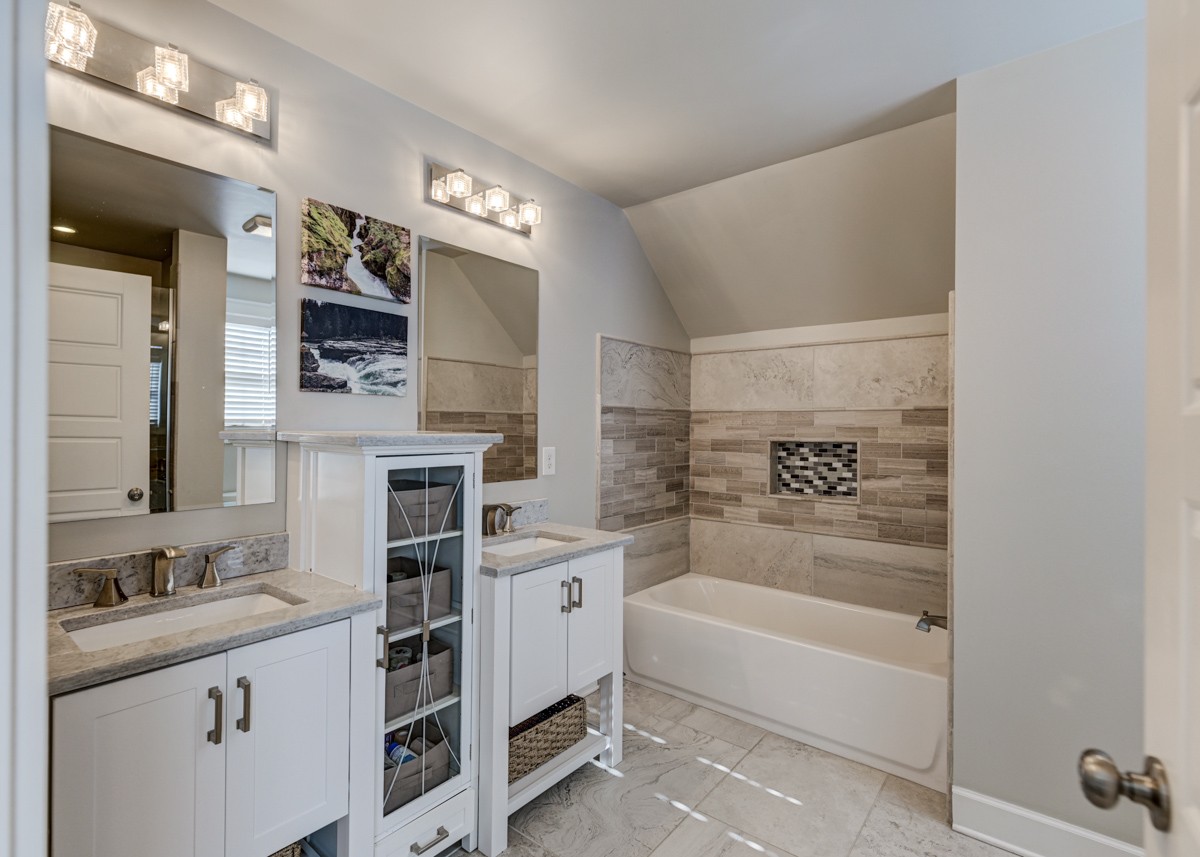 815 Lischey Avenue Nashville, TN 37207 - Photo 20 of 34 a bathroom with a tub sink and mirror