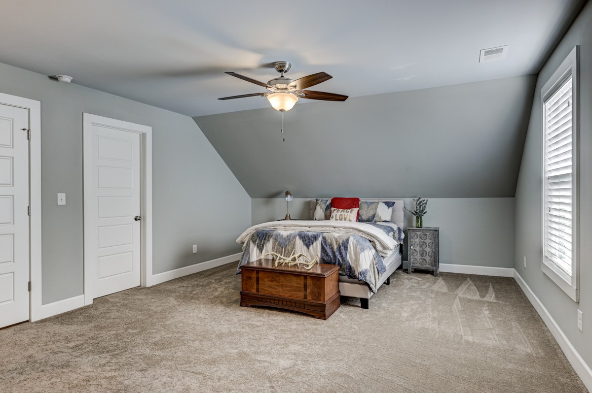 815 Lischey Avenue Nashville, TN 37207 - Photo 24 of 34 a bedroom with a bed and a window