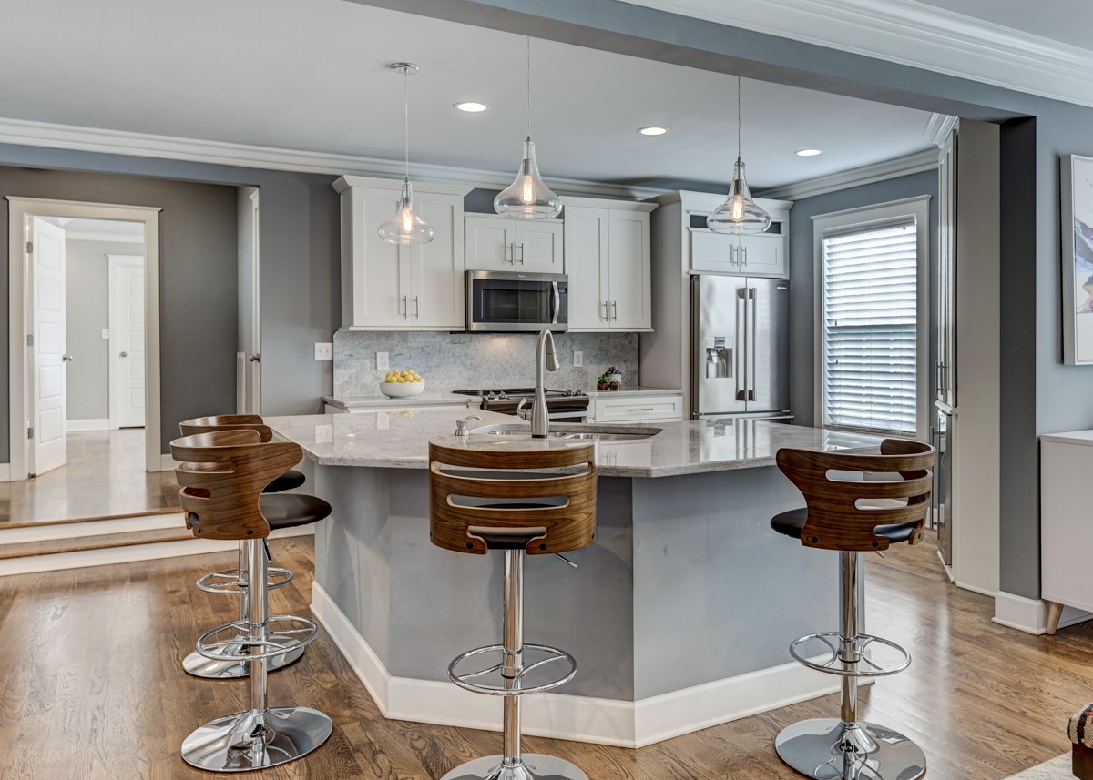 815 Lischey Avenue Nashville, TN 37207 - Photo 8 of 34 a kitchen with stainless steel appliances kitchen island granite countertop a sink and cabinets