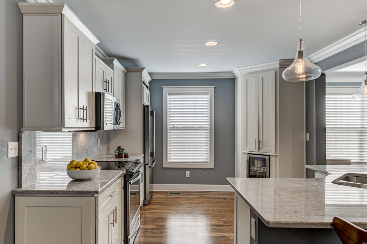 815 Lischey Avenue Nashville, TN 37207 - Photo 10 of 34 a kitchen with stainless steel appliances granite countertop a sink refrigerator stove and microwave