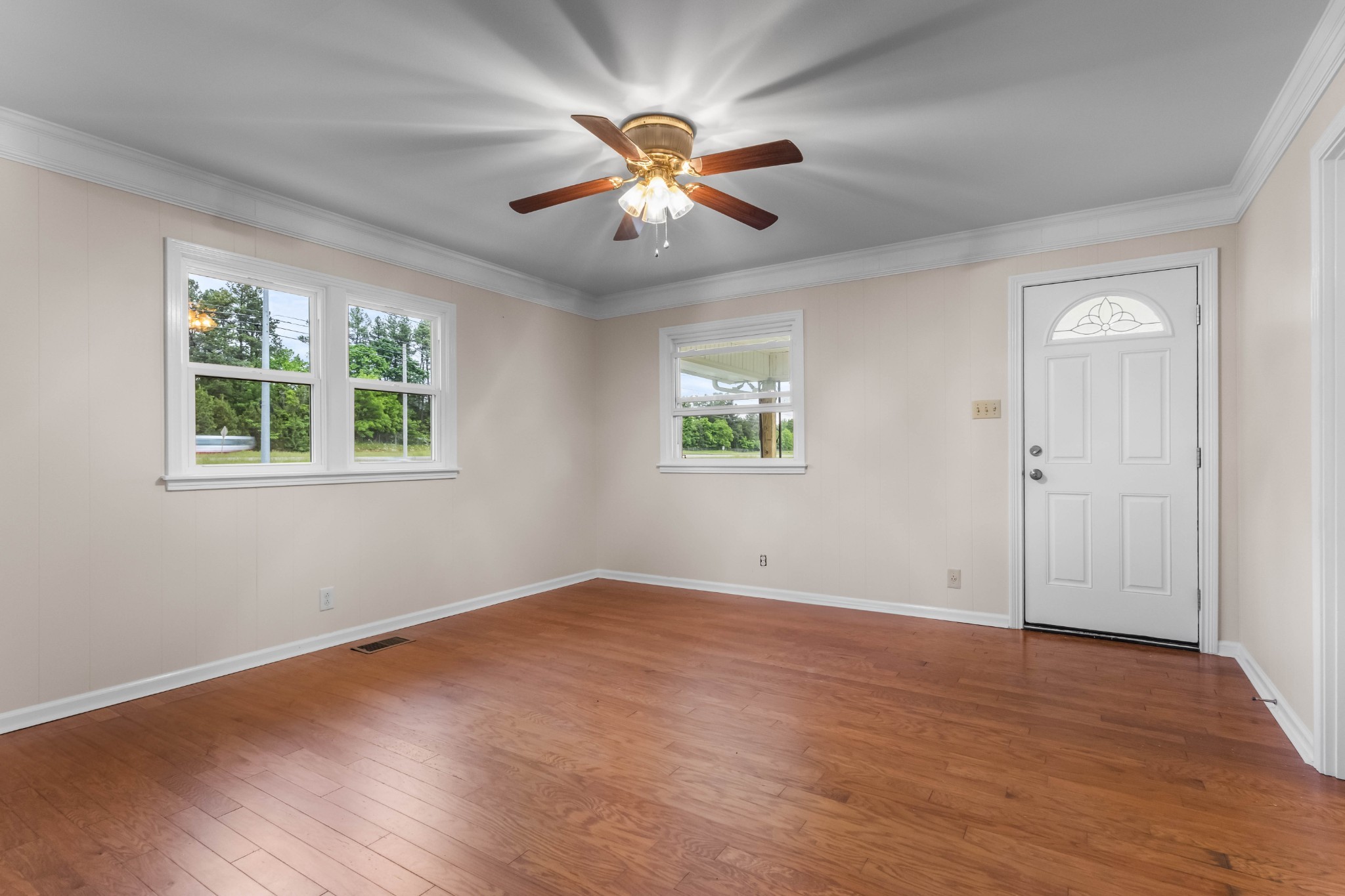 3070 Dover Road Woodlawn, TN 37191 - Photo 13 of 32 a view of an empty room with wooden floor and a window