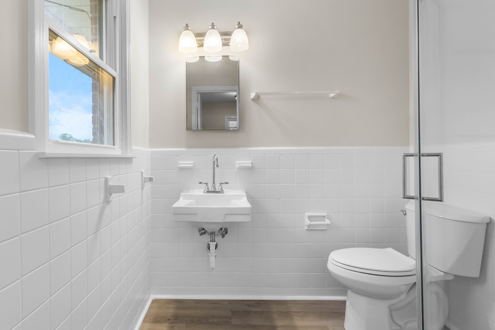 3070 Dover Road Woodlawn, TN 37191 - Photo 15 of 32 a bathroom with a sink a toilet and mirror
