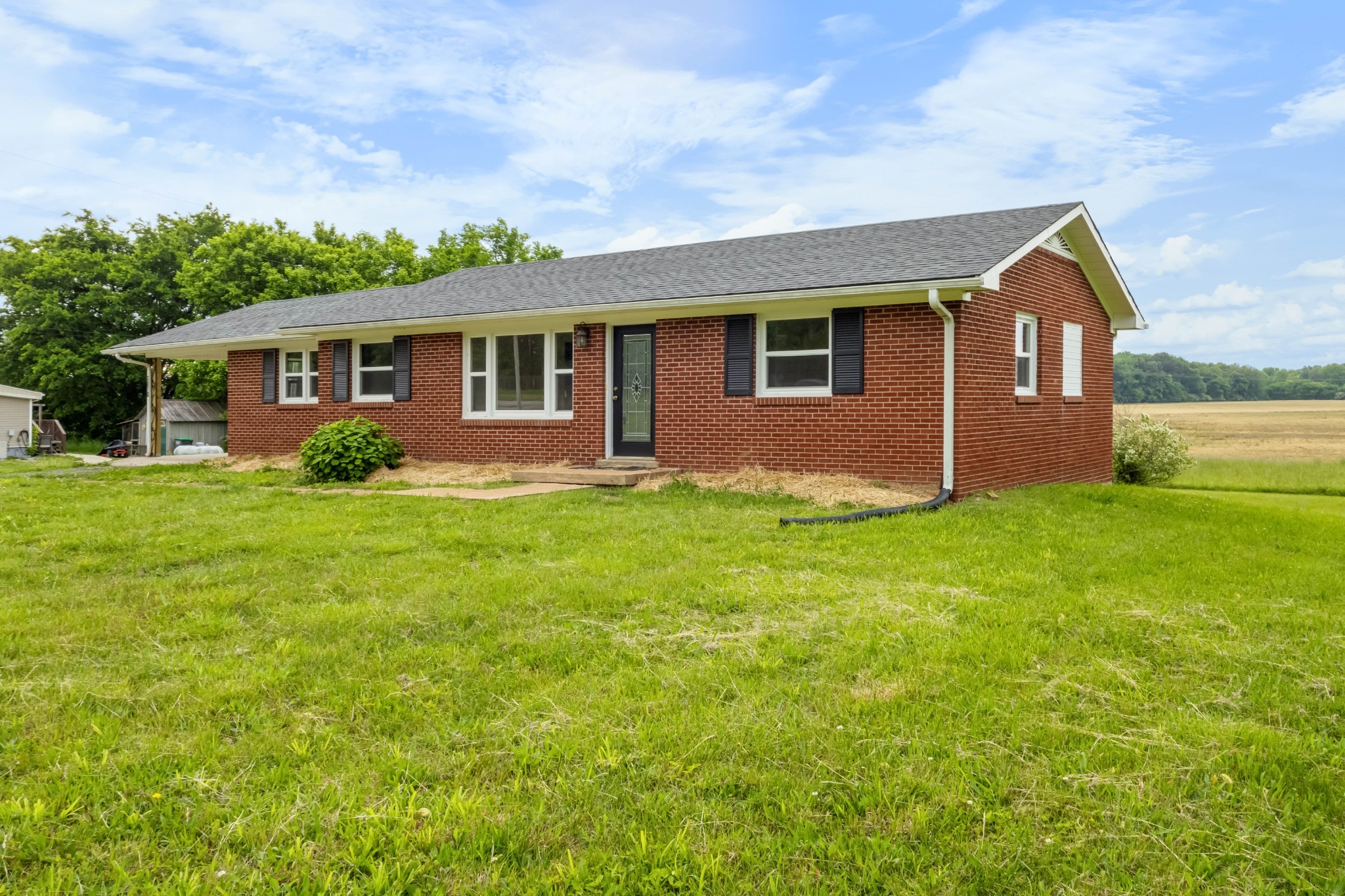 3070 Dover Road Woodlawn, TN 37191 - Photo 2 of 32 a front view of house with yard and green space