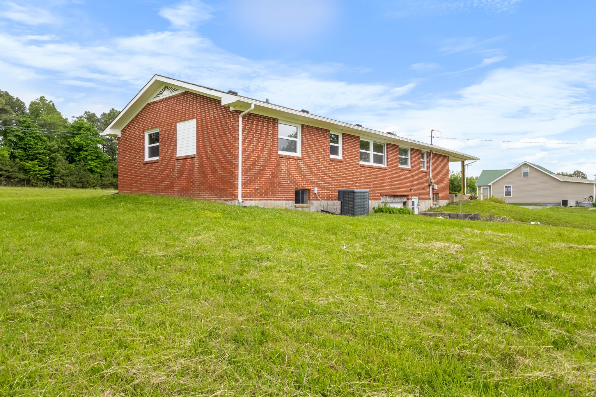 3070 Dover Road Woodlawn, TN 37191 - Photo 25 of 32 a front view of a house with a yard