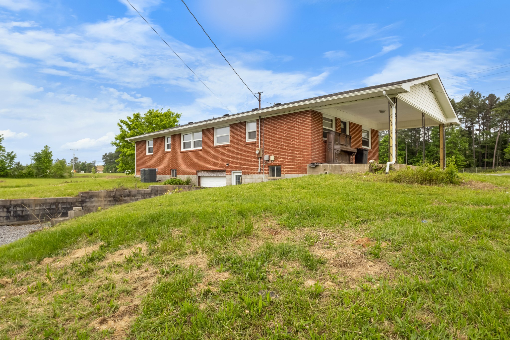 3070 Dover Road Woodlawn, TN 37191 - Photo 29 of 32 a front view of a house with garden