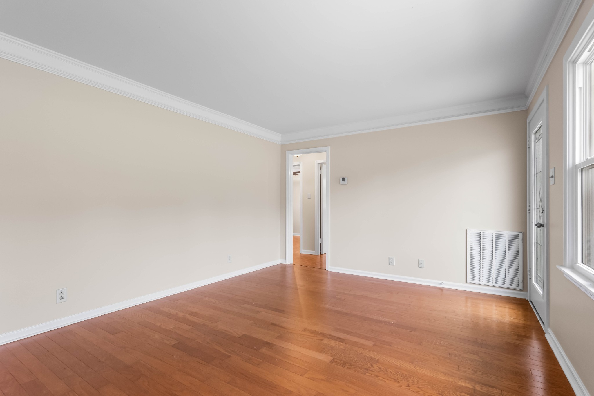 3070 Dover Road Woodlawn, TN 37191 - Photo 7 of 32 an empty room with wooden floor and windows