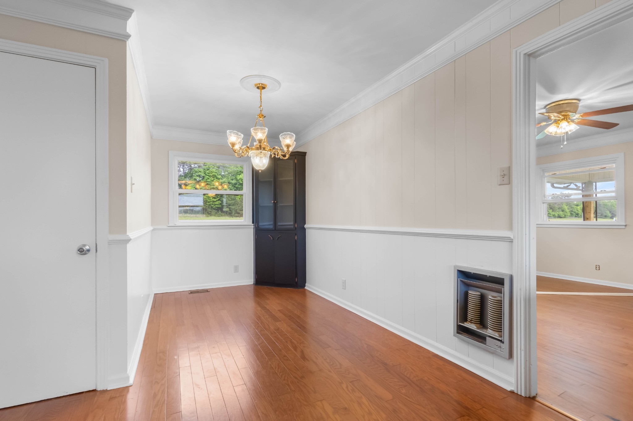 3070 Dover Road Woodlawn, TN 37191 - Photo 8 of 32 a view of a room with wooden floor fireplace and windows