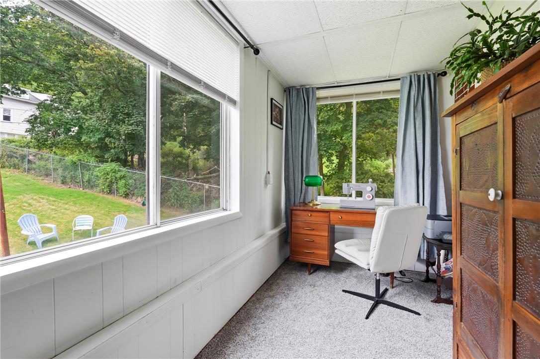 809 Hayes Street Bethlehem, PA 18015 - Photo 20 of 31 Large windows line this cozy home workspace overlooking the lush backyard.
