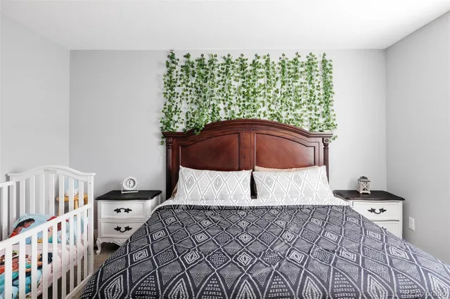 a bedroom with a bed and a chair